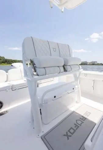 Slide: The Image of 2026 Sea Fox 228 Commander boat interior with cushioned seating and Sea Fox branded mat. - 70