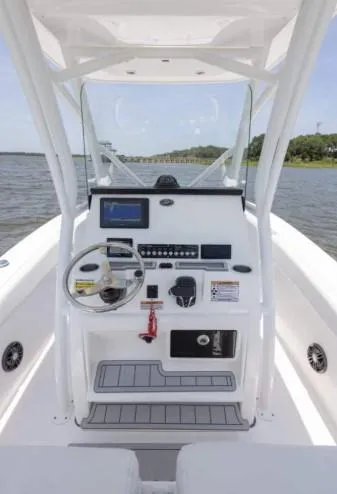 Slide: The Image of 2026 Sea Fox 228 Commander boat console with steering wheel and navigation controls. - 71