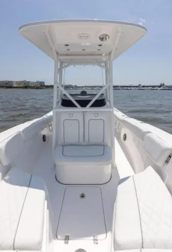 Slide: The Image of 2026 Sea Fox 228 Commander boat on water, featuring spacious deck and modern design. - 72