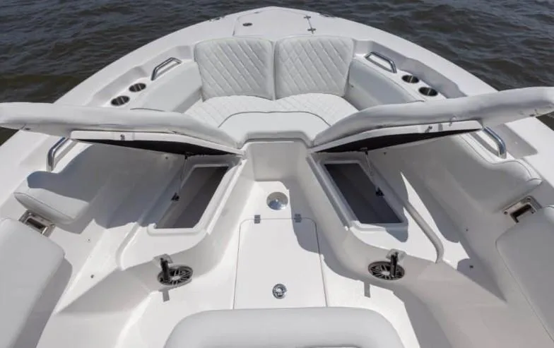 Slide: The Image of 2026 Sea Fox 228 Commander boat interior with open storage compartments and cushioned seating. - 73