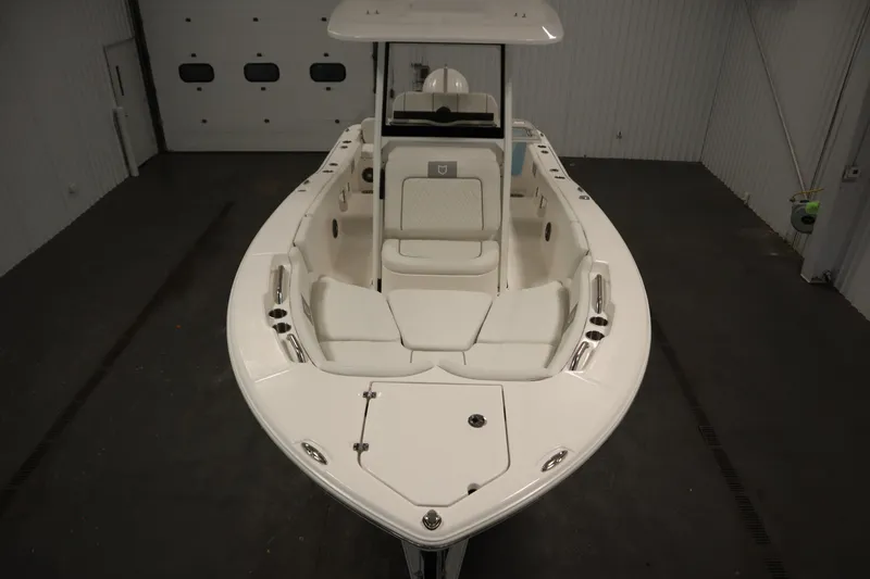 Slide: The Image of 2026 Sea Fox 228 Commander boat in indoor storage, showcasing sleek design and spacious seating. - 8