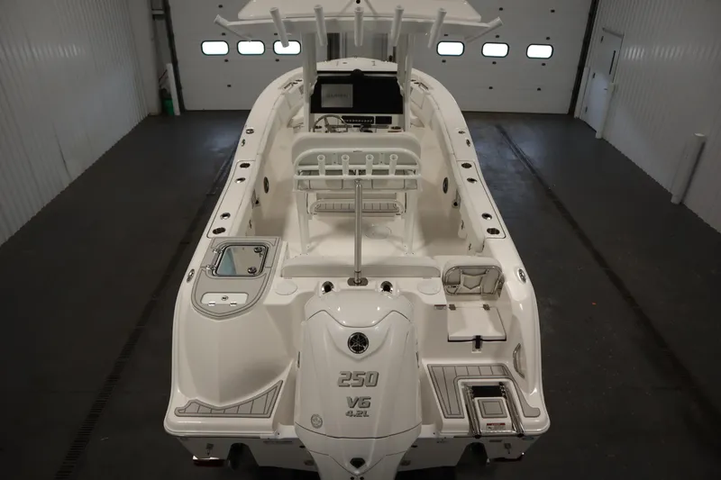 Slide: The Image of 2026 Sea Fox 228 Commander boat in indoor storage, showcasing sleek design and powerful engine. - 9