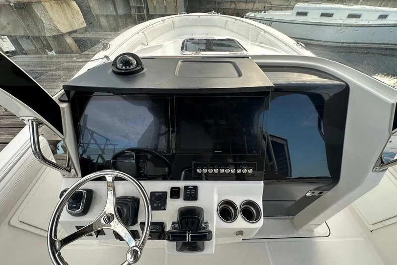 Slide: The Image of 2017 Edgewater 368CC cabin interior with bed and compact bathroom. - 15