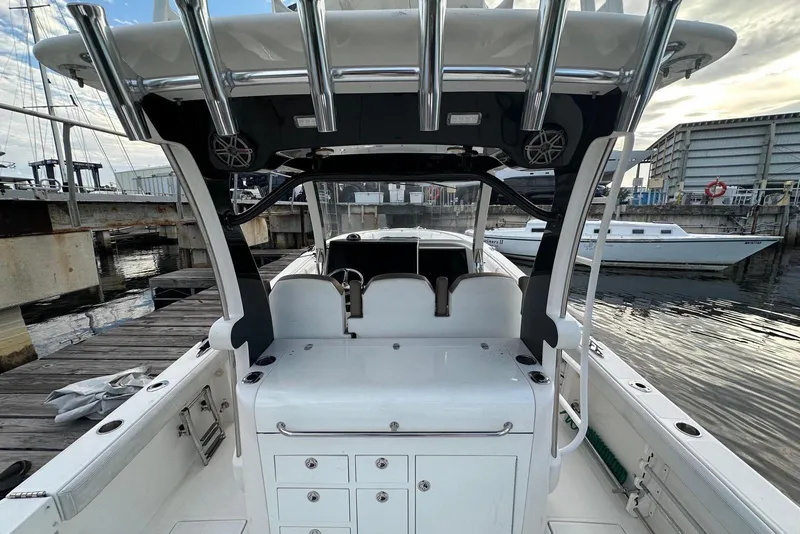 Slide: The Image of Luxurious 2017 Edgewater 368CC boat interior with modern kitchen amenities and wooden cabinetry. - 16
