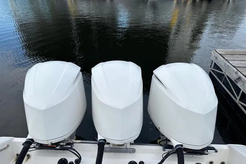 Slide: The Image of Control panel of 2017 Edgewater 368CC boat with dual Garmin screens and steering wheel. - 9