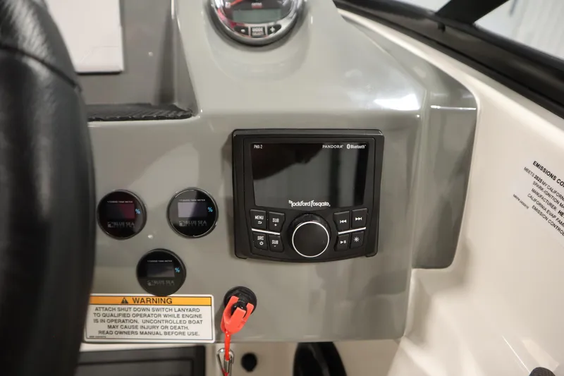 Slide: The Image of Control panel of 2025 Heyday WT Surf boat with audio system and gauges. - 21