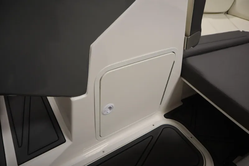 Slide: The Image of 2025 Heyday WT Surf boat interior with storage compartment and seating area. - 26