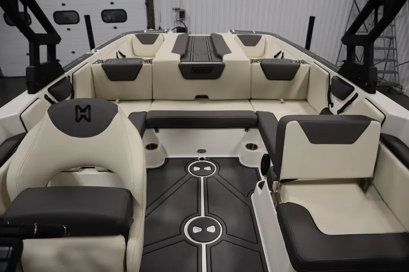 Slide: The Image of 2025 Heyday WT Surf boat interior with beige and black seating, modern design. - 29
