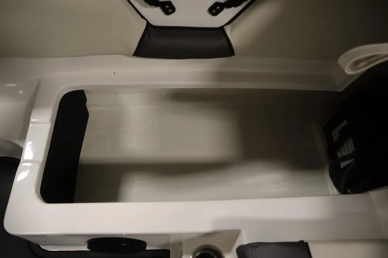 Slide: The Image of 2025 Heyday WT Surf boat interior storage compartment, featuring sleek design and ample space. - 33