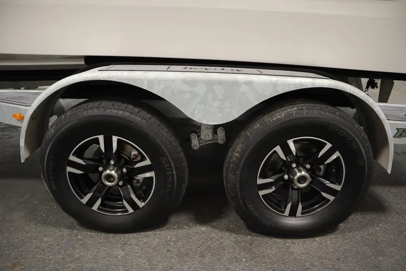 Slide: The Image of Trailer wheels of 2025 Heyday WT Surf boat on pavement. - 44