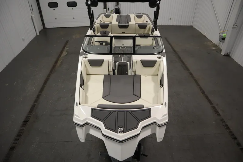 Slide: The Image of 2025 Heyday WT Surf boat interior with sleek seating and modern design in a showroom. - 8