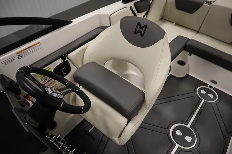 Slide: The Image of 2025 Heyday WT Surf boat interior with steering wheel and seating. - 24