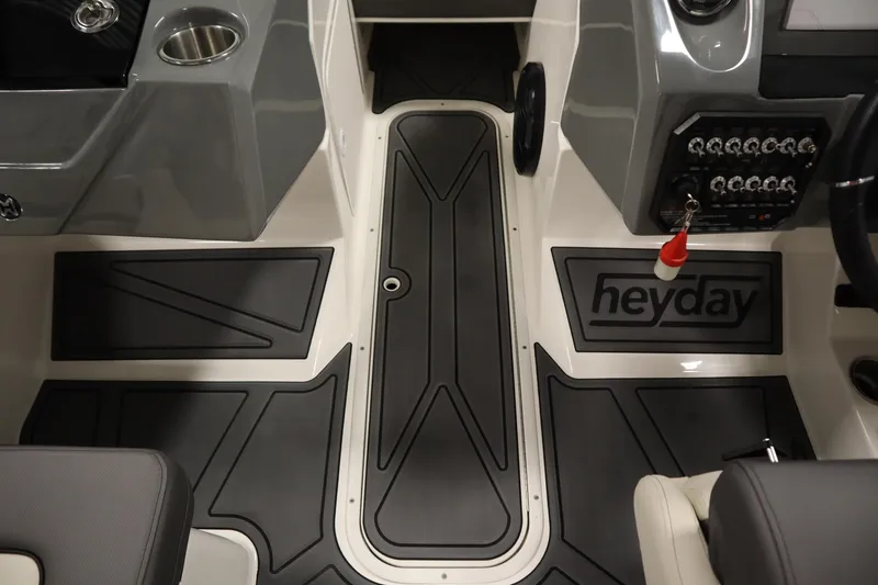 Slide: The Image of 2025 Heyday WT Surf boat interior with sleek dashboard and modern controls. - 25