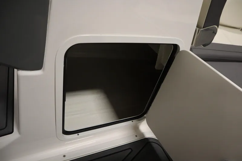 Slide: The Image of Open storage compartment on 2025 Heyday WT Surf boat. - 27