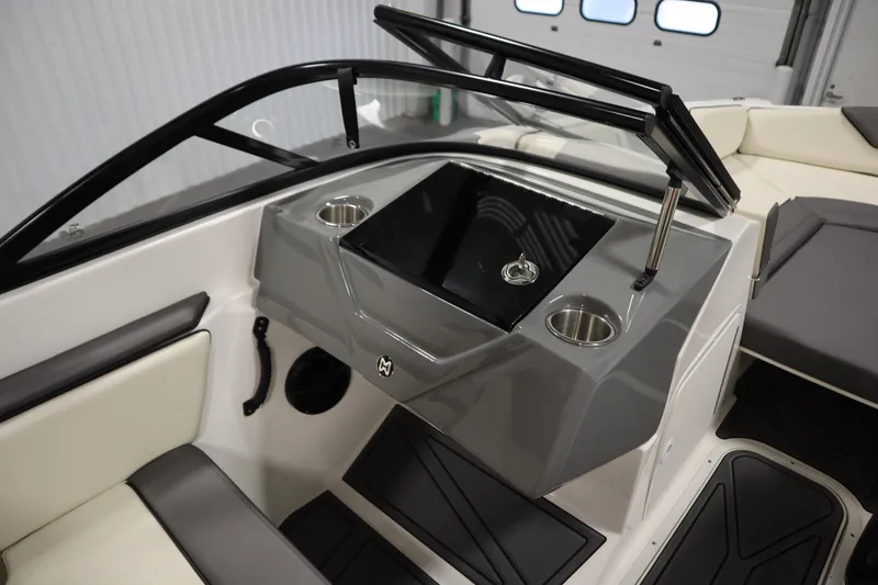 Slide: The Image of 2025 Heyday WT Surf boat interior with sleek dashboard and cup holders. - 28