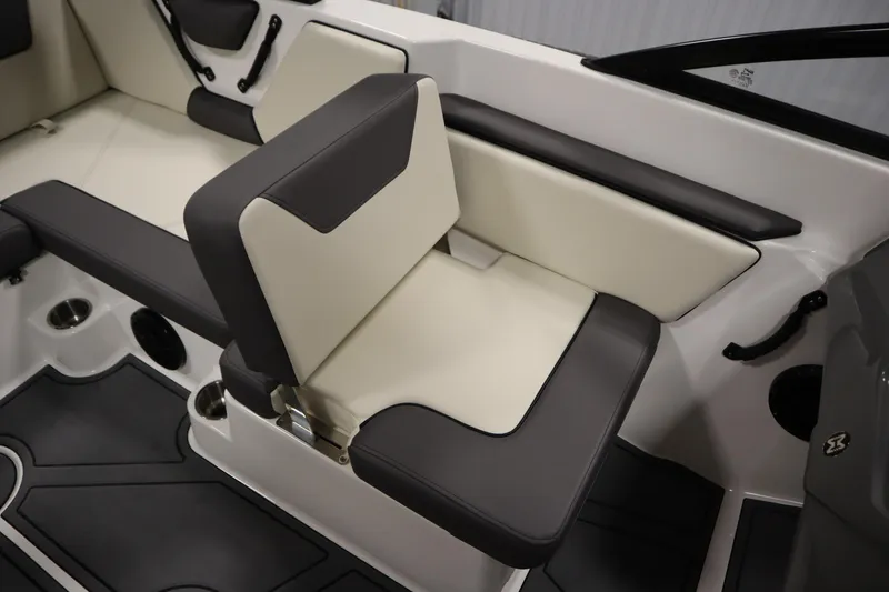 Slide: The Image of 2025 Heyday WT Surf boat interior with cushioned seating and cup holders. - 30