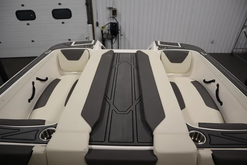 Slide: The Image of 2025 Heyday WT Surf boat interior with cushioned seating and cup holders. - 35