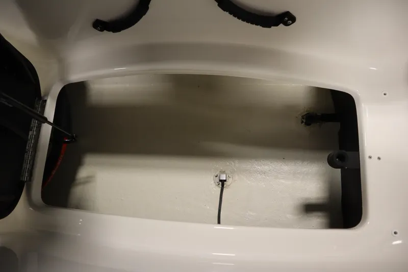 Slide: The Image of Storage compartment of 2025 Heyday WT Surf boat, featuring a clean, spacious interior. - 38