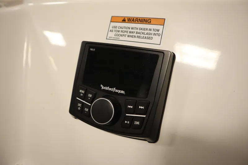 Slide: The Image of Rockford Fosgate audio control panel on 2025 Heyday WT Surf boat dashboard. - 39