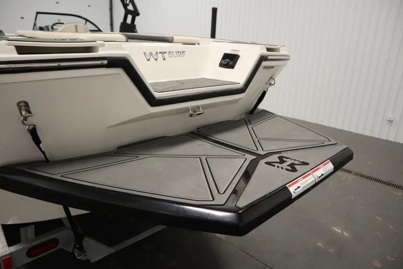 Slide: The Image of 2025 Heyday WT Surf boat rear platform in a showroom setting. - 41