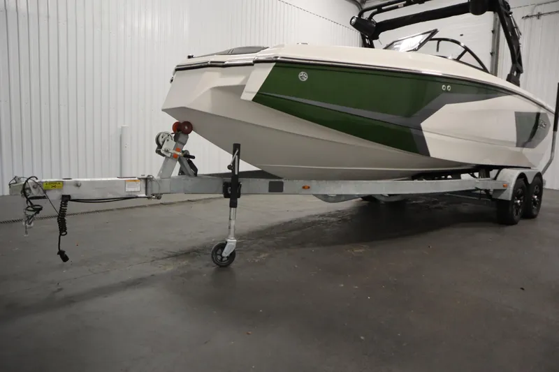 Slide: The Image of 2025 Heyday WT Surf boat on trailer in indoor storage facility. - 43
