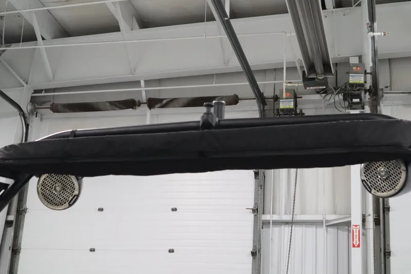 Slide: The Image of 2025 Heyday WT Surf boat speakers and canopy in a garage setting. - 45