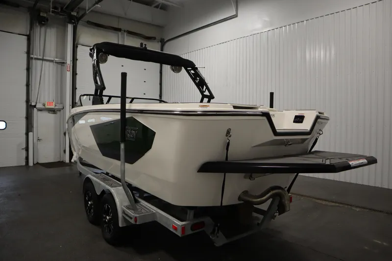 Slide: The Image of 2025 Heyday WT Surf boat on trailer in indoor storage facility. - 6