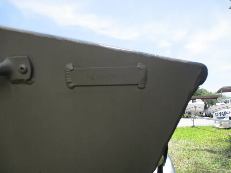 Slide: The Image of 2023 Alweld 1648SS boat detail with visible hull identification number. - 9