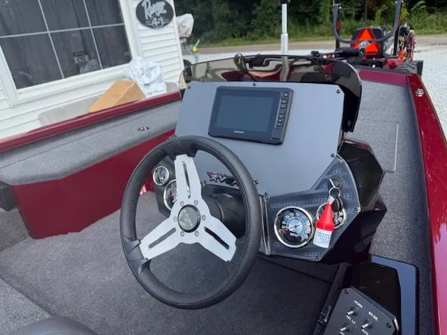 Slide: The Image of 2026 Vexus AVX181 boat dashboard with steering wheel and navigation display. - 5