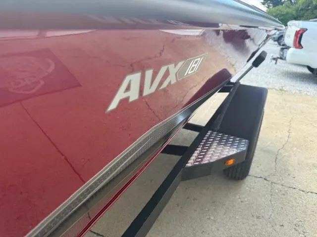 Slide: The Image of 2026 Vexus AVX181 boat on trailer, close-up view of side and logo. - 9