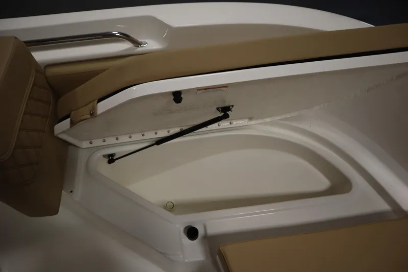 Slide: The Image of Storage compartment in 2026 Bayliner 20 Cc Trophy boat with tan seating. - 11