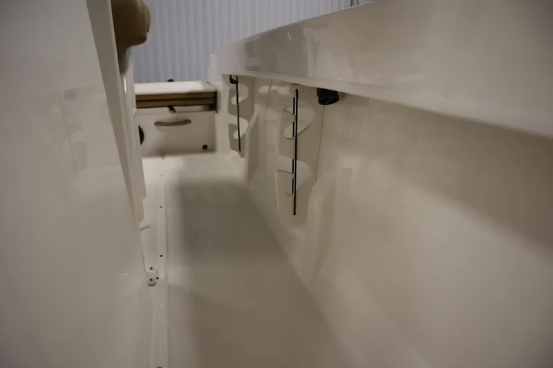 Slide: The Image of 2026 Bayliner 20 Cc Trophy interior view, showcasing sleek white design and storage features. - 18