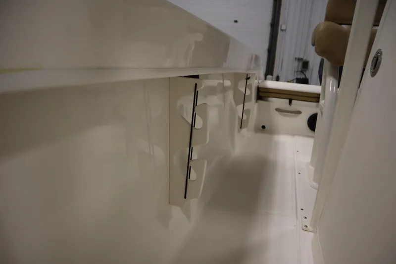 Slide: The Image of 2026 Bayliner 20 Cc Trophy interior view, showcasing rod holders and seating area. - 19