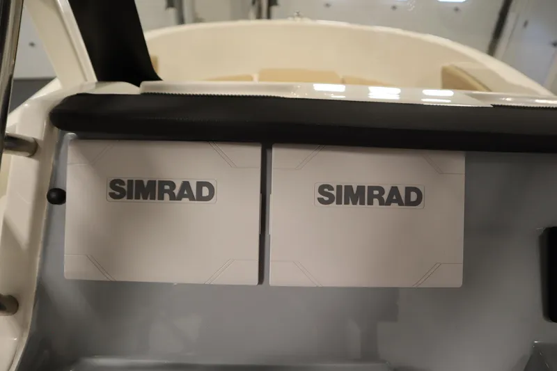 Slide: The Image of 2026 Bayliner 20 Cc Trophy dashboard featuring dual Simrad displays. - 23