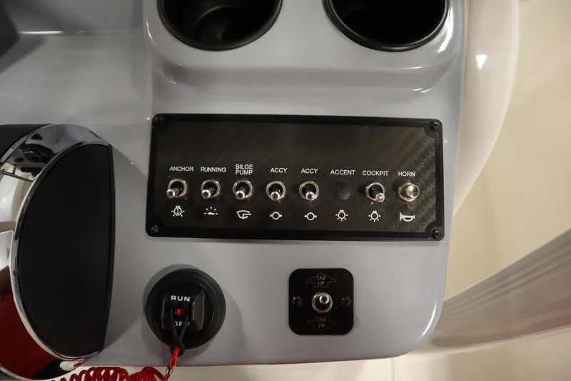 Slide: The Image of Control panel of 2026 Bayliner 20 Cc Trophy boat with switches and indicators. - 25