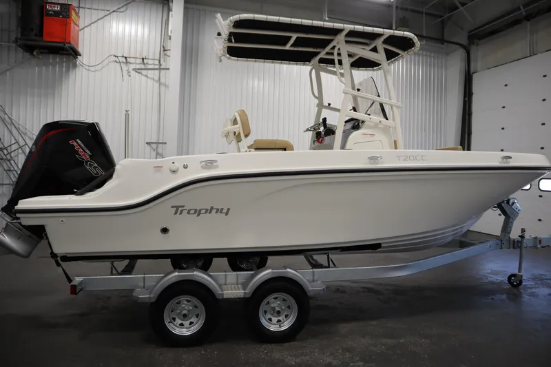 Slide: The Image of 2026 Bayliner 20 Cc Trophy boat on trailer in indoor setting. - 3