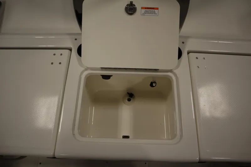Slide: The Image of 2026 Bayliner 20 Cc Trophy boat storage compartment with open lid. - 33