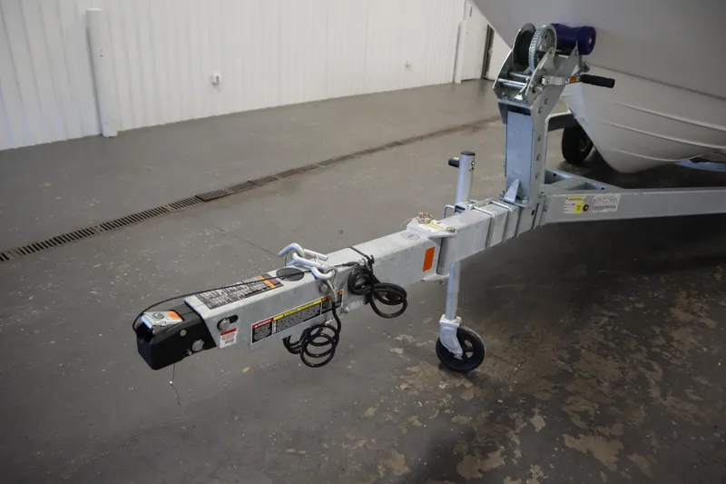 Slide: The Image of 2026 Bayliner 20 Cc Trophy boat trailer hitch in a garage setting. - 39