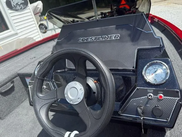 Slide: The Image of 2026 Crestliner XF179 boat dashboard with steering wheel and gauges. - 5