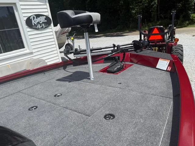 Slide: The Image of 2026 Crestliner XF179 boat with gray deck and seat, parked near a building. - 6