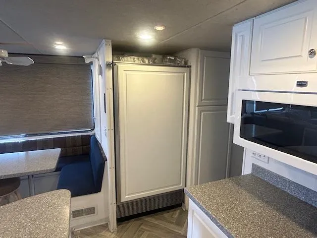 Slide: The Image of Interior of 1999 Skipperliner 59 x 14 Houseboat with modern kitchen and dining area. - 11