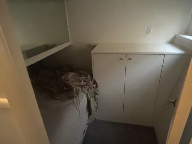 Slide: The Image of Small bedroom in a 1999 Skipperliner 59 x 14 houseboat with bed and cabinet. - 16