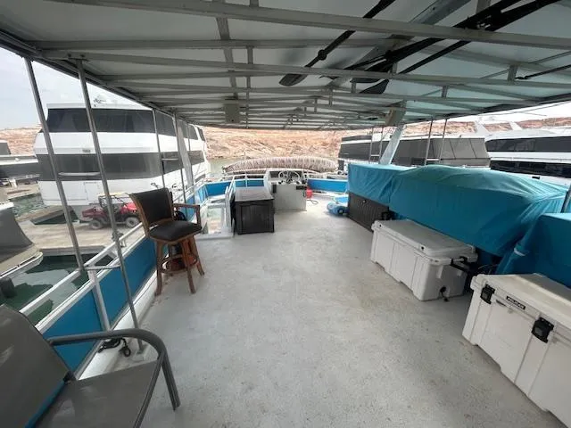Slide: The Image of 1999 Skipperliner 59 x 14 houseboat deck with seating and storage. - 28