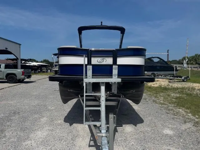 Slide: The Image of 2026 Barletta LUSSO 25 UCA pontoon boat on trailer, parked outdoors. - 4