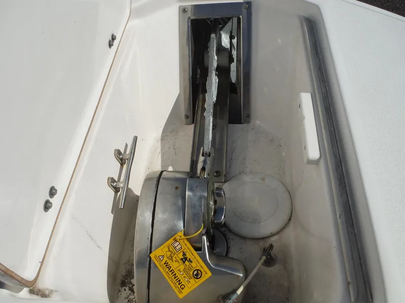 Slide: The Image of 2017 Sea Fox 266 Commander anchor compartment with winch and warning label. - 12