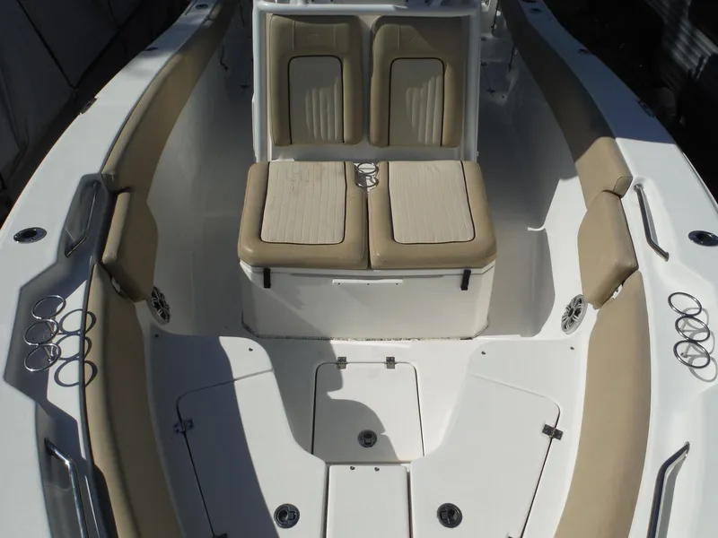 Slide: The Image of 2017 Sea Fox 266 Commander boat interior with beige seating and cup holders. - 13