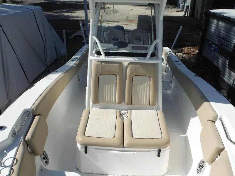 Slide: The Image of 2017 Sea Fox 266 Commander boat interior with beige seating and center console. - 15
