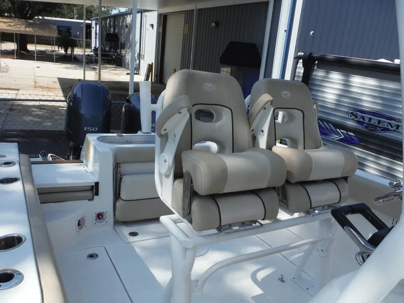 Slide: The Image of 2017 Sea Fox 266 Commander boat interior with dual cushioned seats and twin outboard motors. - 17