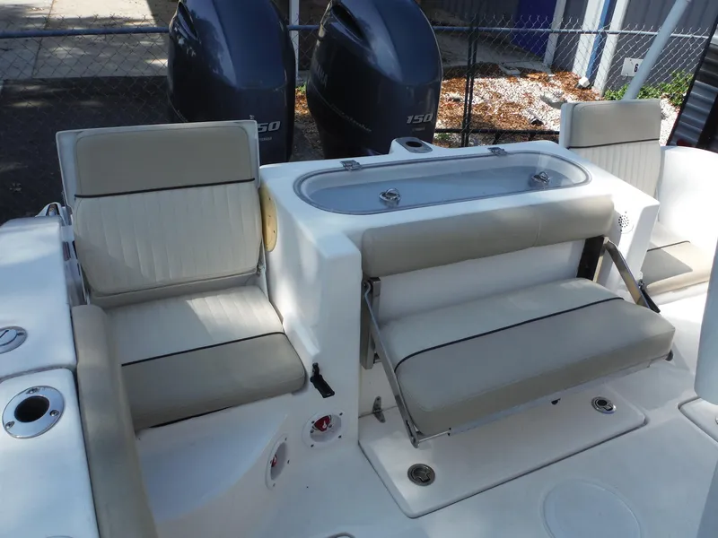 Slide: The Image of 2017 Sea Fox 266 Commander boat seating area with dual outboard engines. - 22