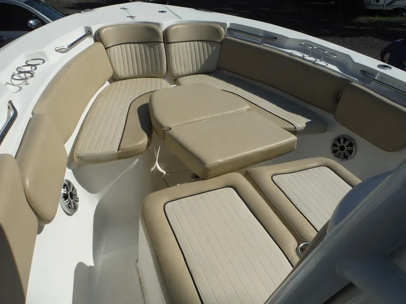 Slide: The Image of 2017 Sea Fox 266 Commander boat interior with beige cushioned seating and cup holders. - 30